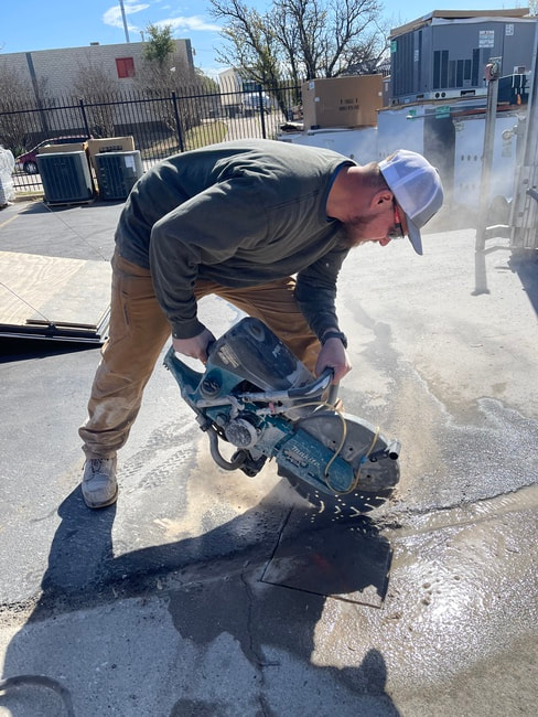 saw cutting concrete for safety bollards