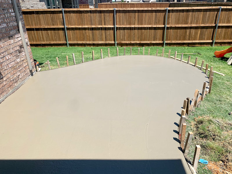 Another view of rounded concrete patio extension