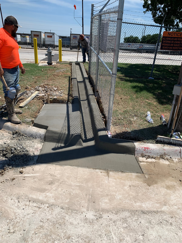 Concrete poured for gate tracks and motor pad